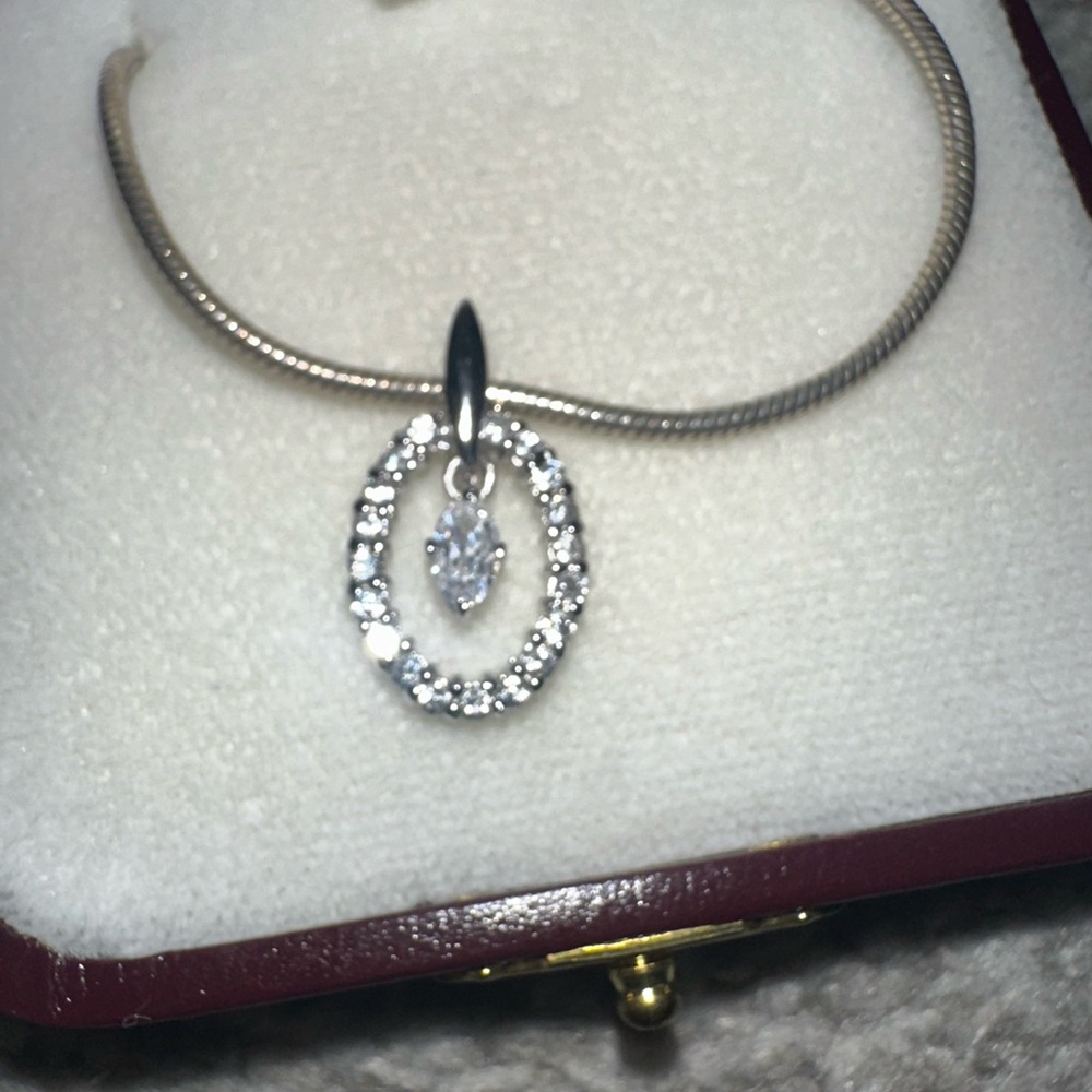 Silver Necklace with Teardrop Pendant and Sparkling Diamonds